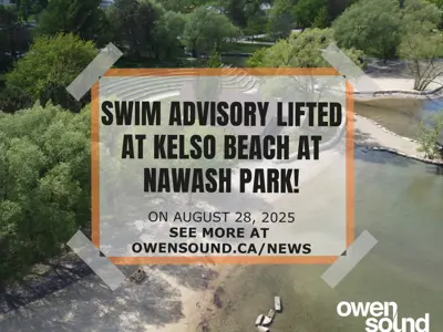 View of Kelso Beach water with swim ban lifted words over it