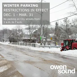 Sidewalk snow plow with words reminding people not to park overnight on the street in the winter